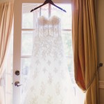 01 see through lace wedding dress with sweetheart neckline and corset bodice on custom Mrs wedding hanger by Gladys Jem Photography and J Squared Events